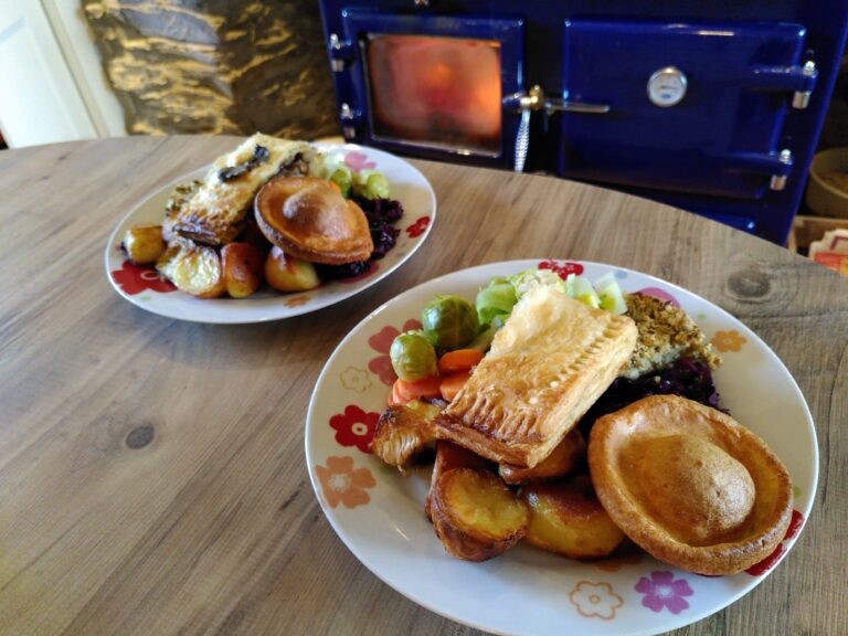 A vegetarian Christmas dinner featuring a festive wellington, roast potatoes, seasonal vegetables and a Yorkshire pudding