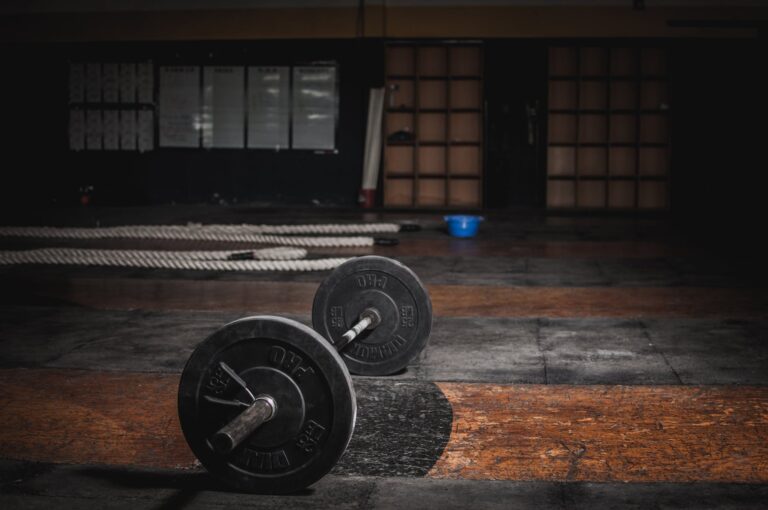 A set of weights next on the floor in a gym.