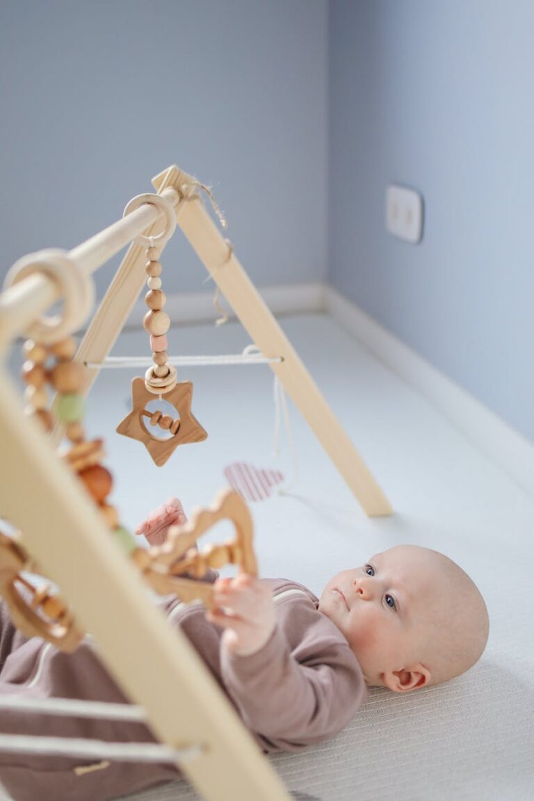 An infant using a baby gym